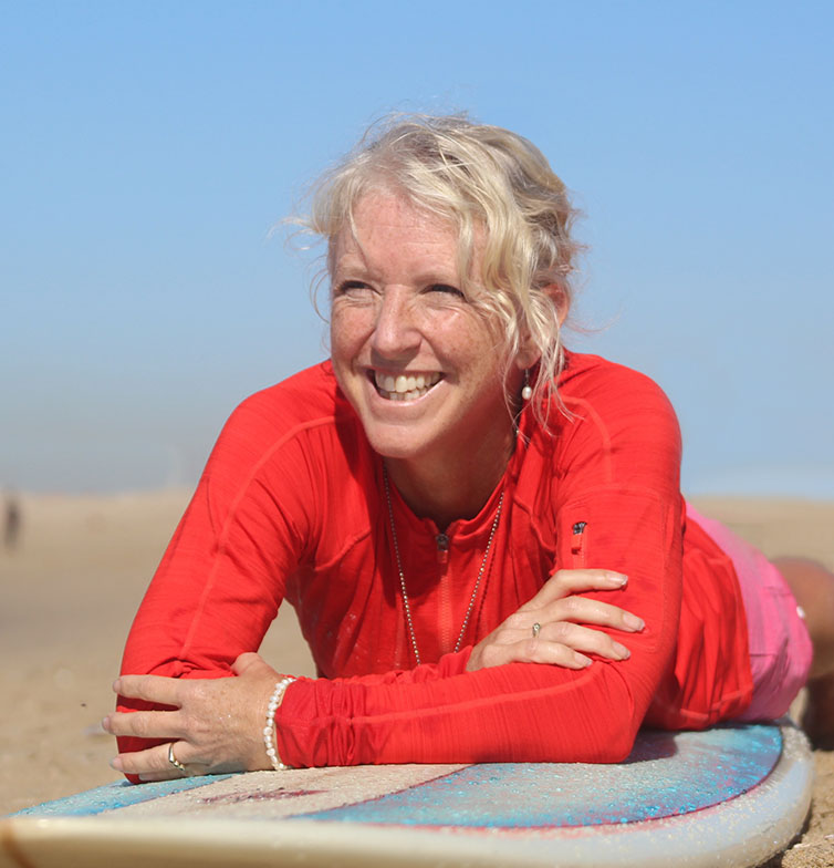 Author Kim Dwinell and surfboard