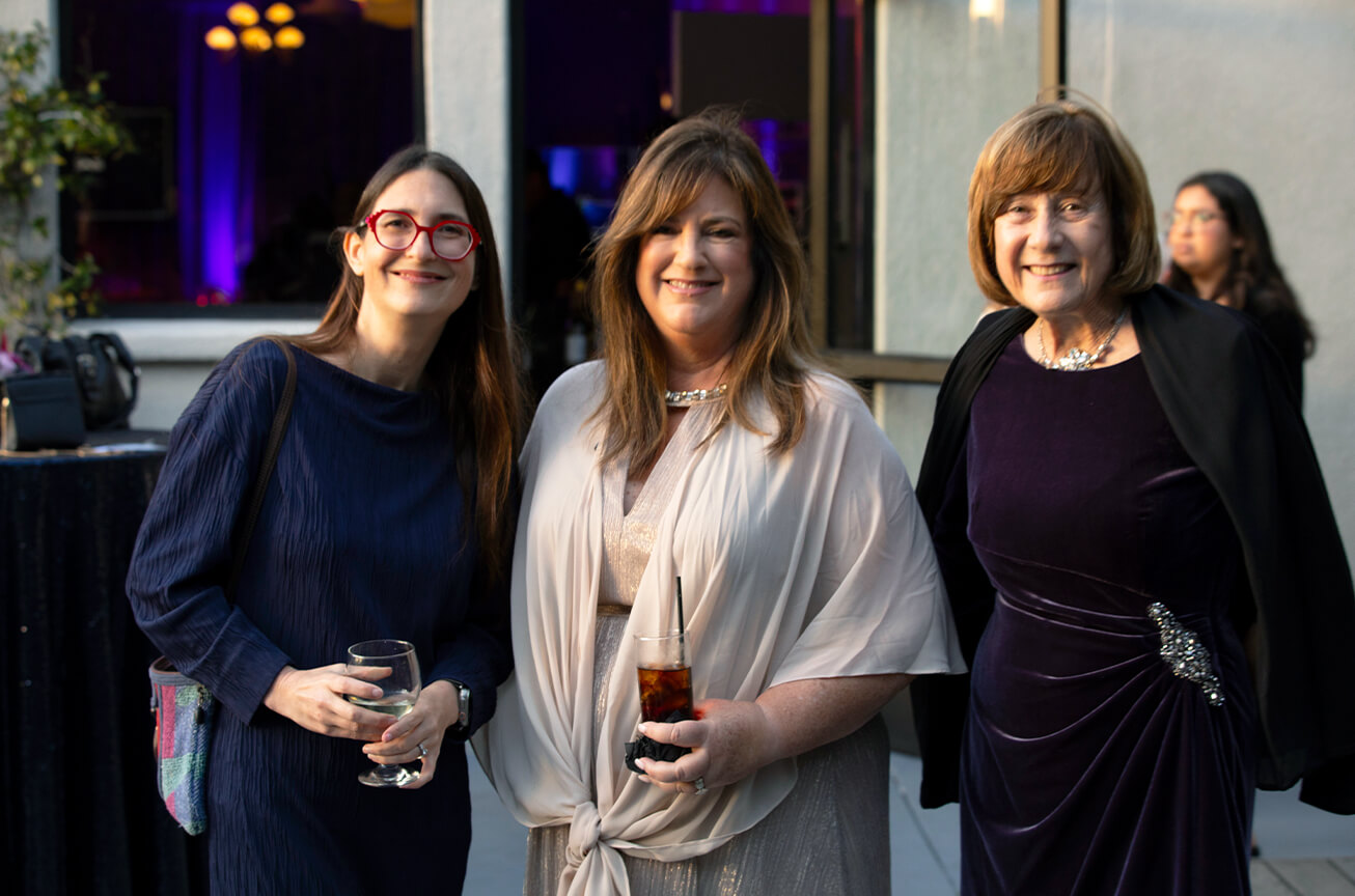 Laura Archuleta with guests at the reception.